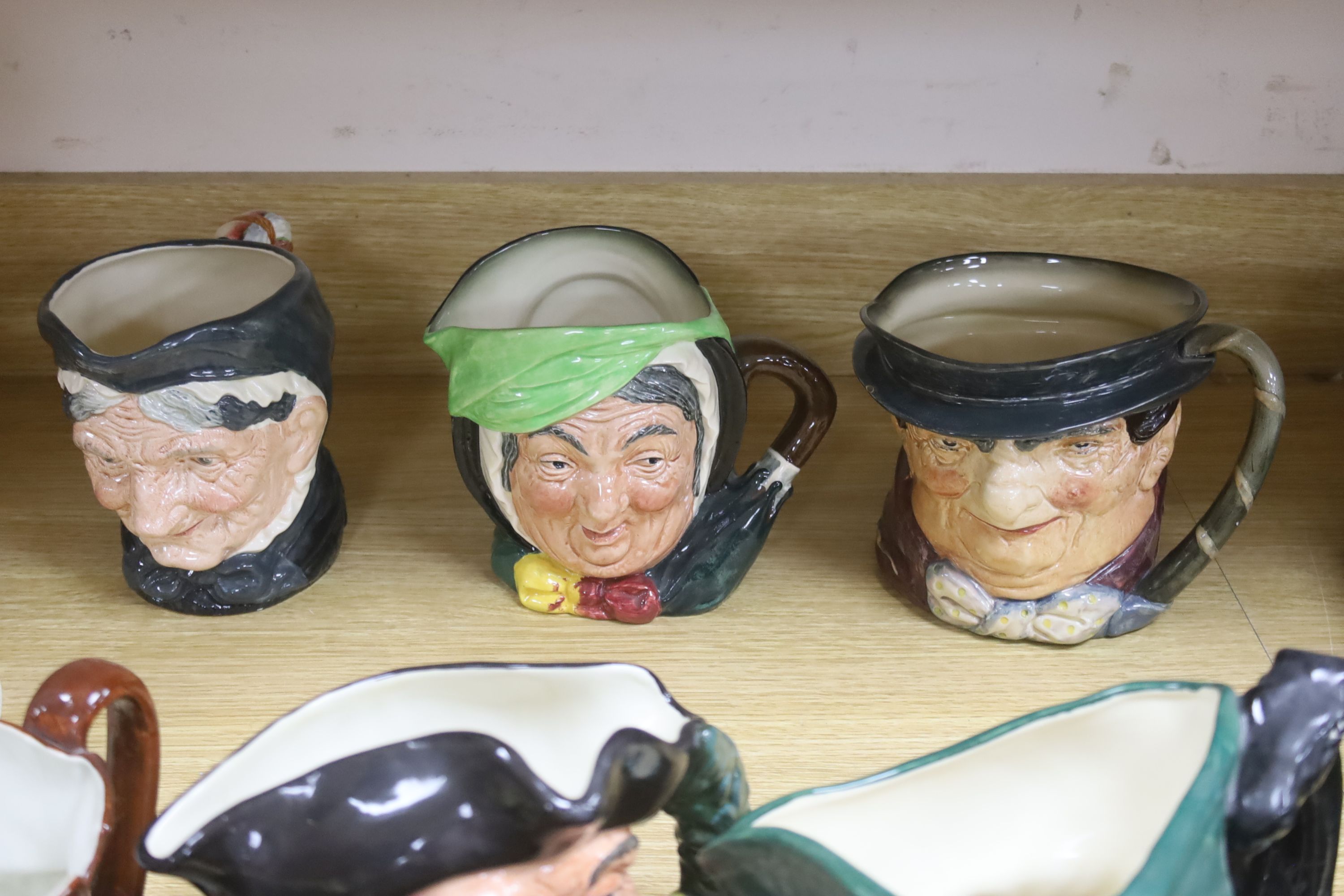 A large collection of nine Royal Doulton character jugs including Falsestaff, The Poacher, Old Charley, Mine Host, Dick Turpin, Granny and three others